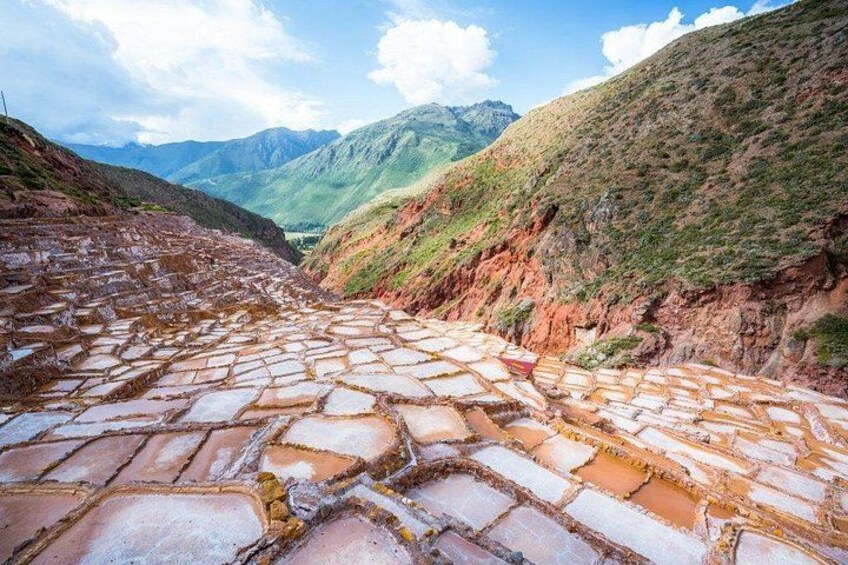 A terraced stone pathway leading through a mountainous landscape. 5