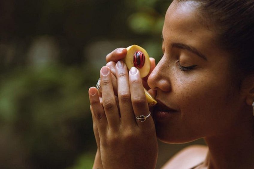 A person holding a fruit. 5