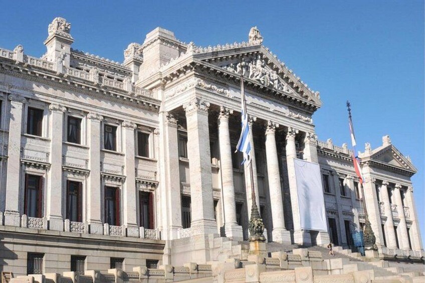 A large, classical building with columns and a grand entrance. 5
