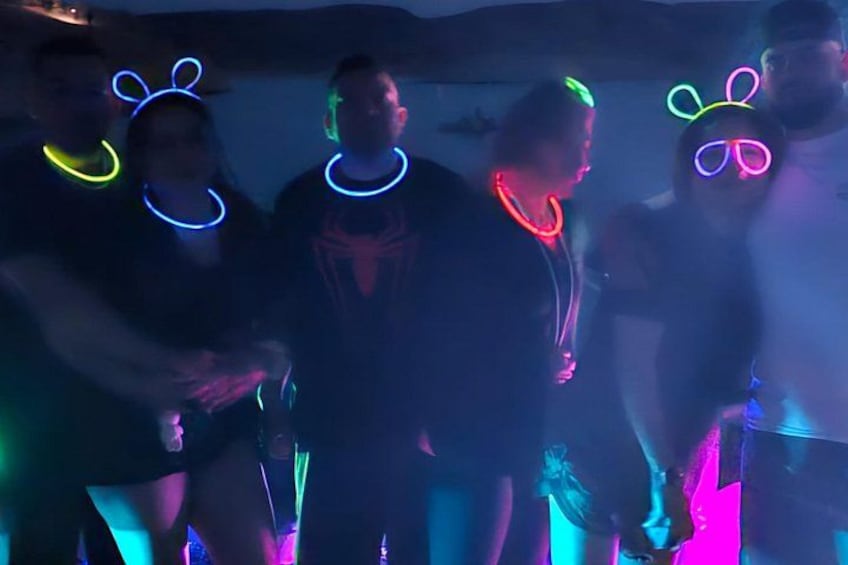 People wearing glow-in-the-dark headbands. 3