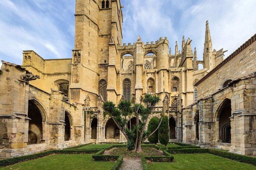 A historic building with a large tower and arched windows. 3