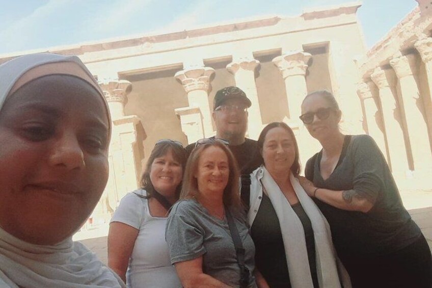 A group of people in front of a building with classical columns. 3