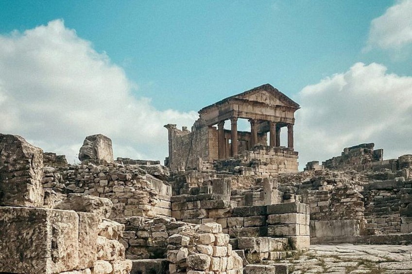 Ancient ruins with a prominent temple structure. 1