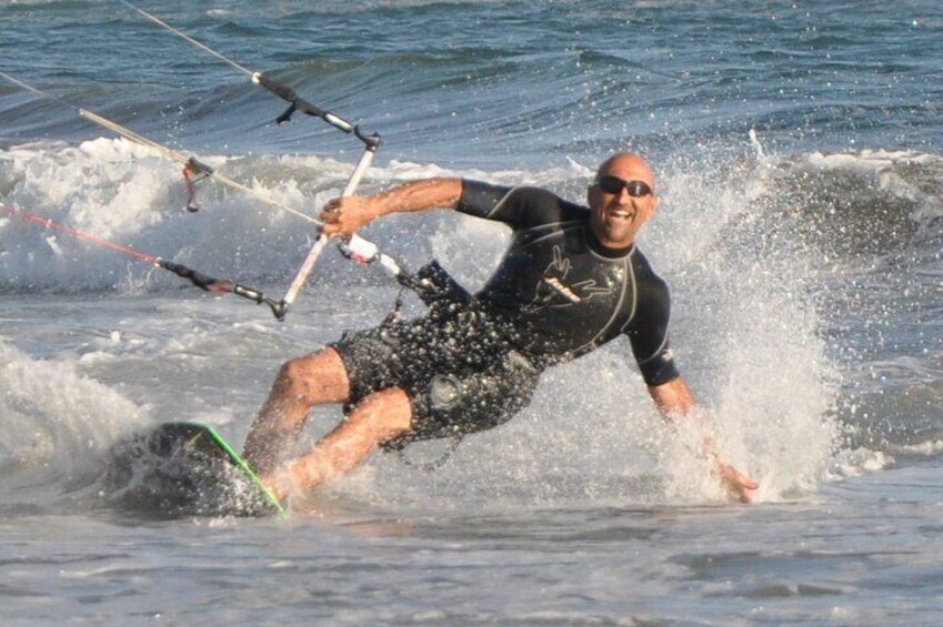A person kiteboarding on the water. 1