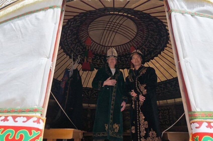 A traditional tent with ornate patterns and a large circular ceiling design. 3