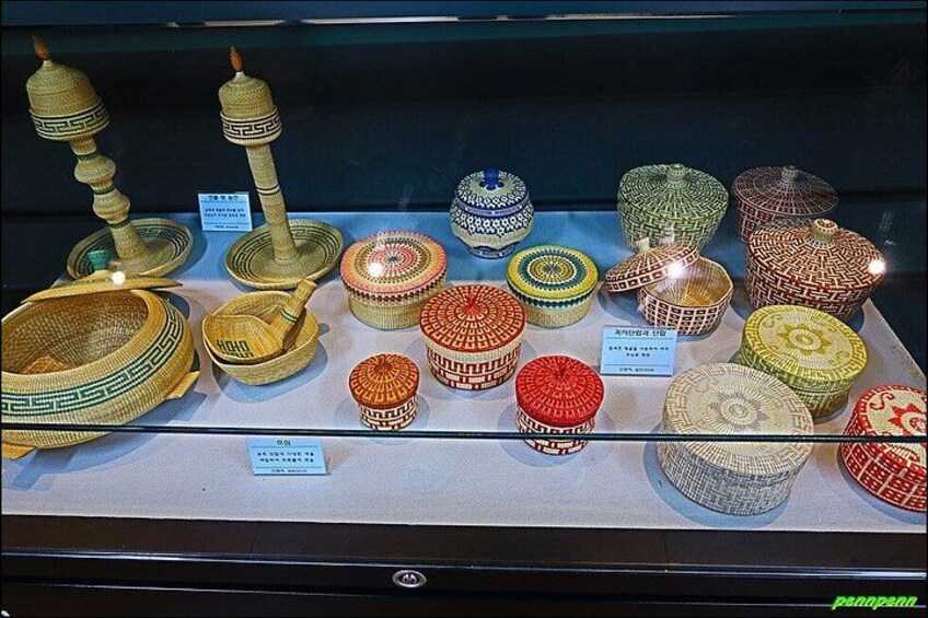 A display of various woven baskets and containers with labels. 4