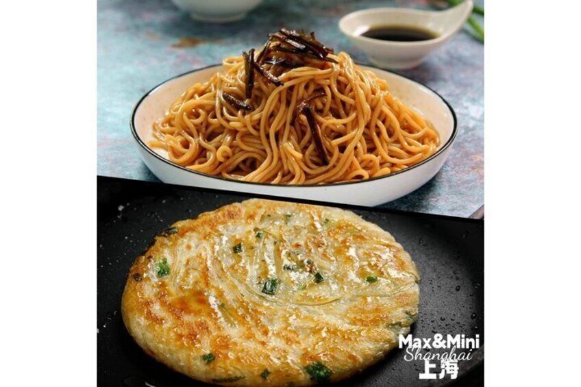 A bowl of noodles topped with fried dough and a pan with a golden-brown pancake. 3