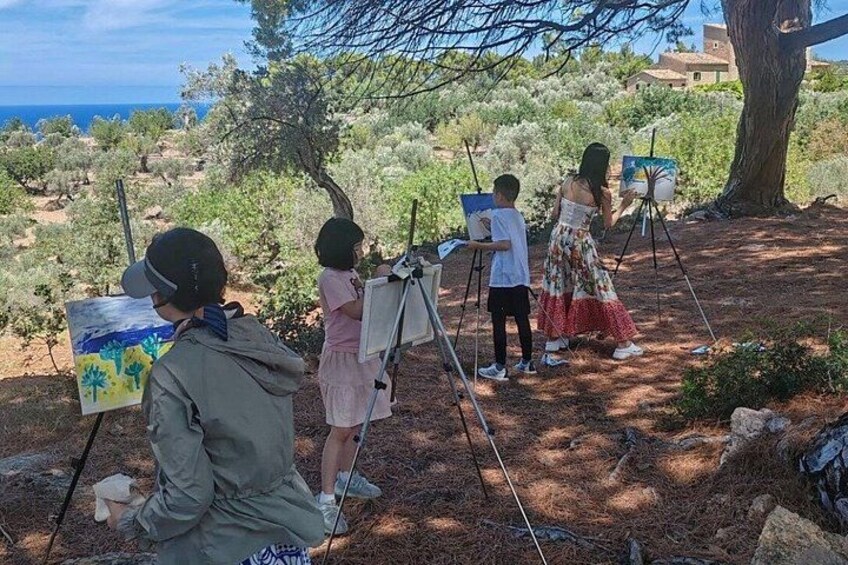 People painting outdoors with a view of the sea. 2
