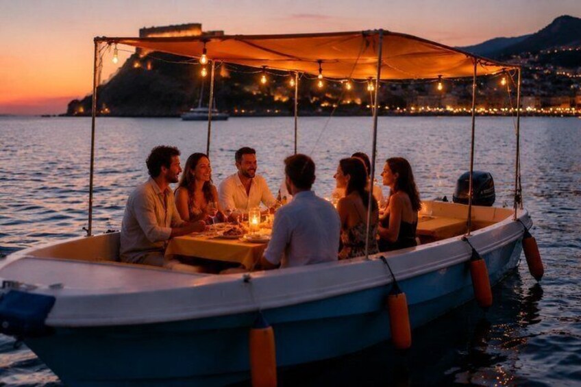 A boat with people dining at sunset, a cityscape in the background, and string lights. 1