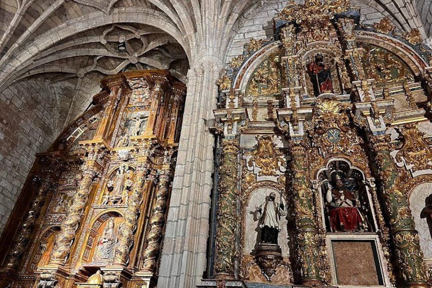 An ornate church interior with detailed carvings and statues. 4