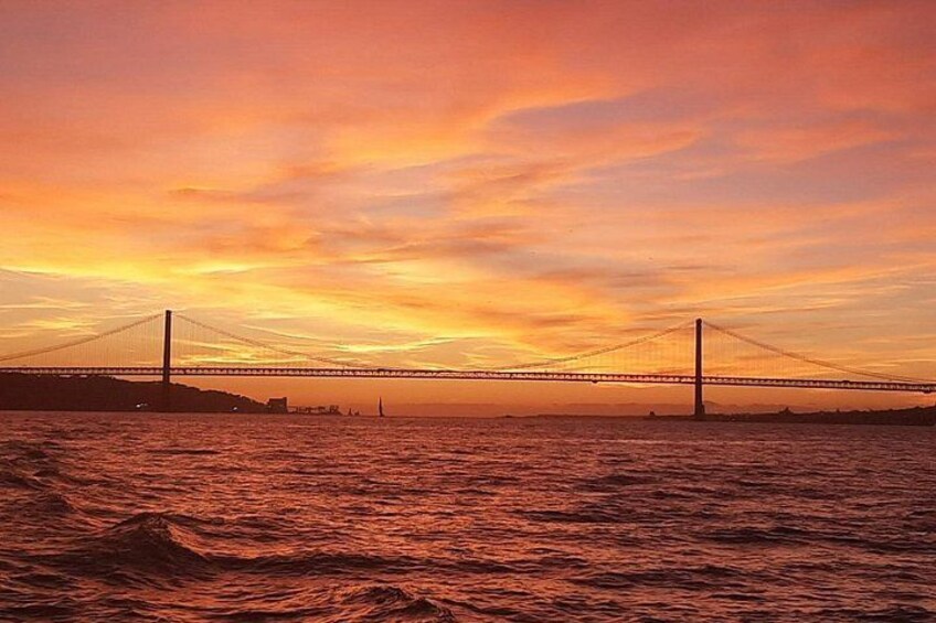 A bridge over water during sunset. 5