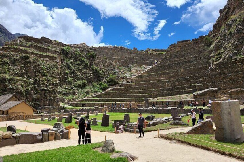 An ancient amphitheater with tiered seating and stone structures. 2