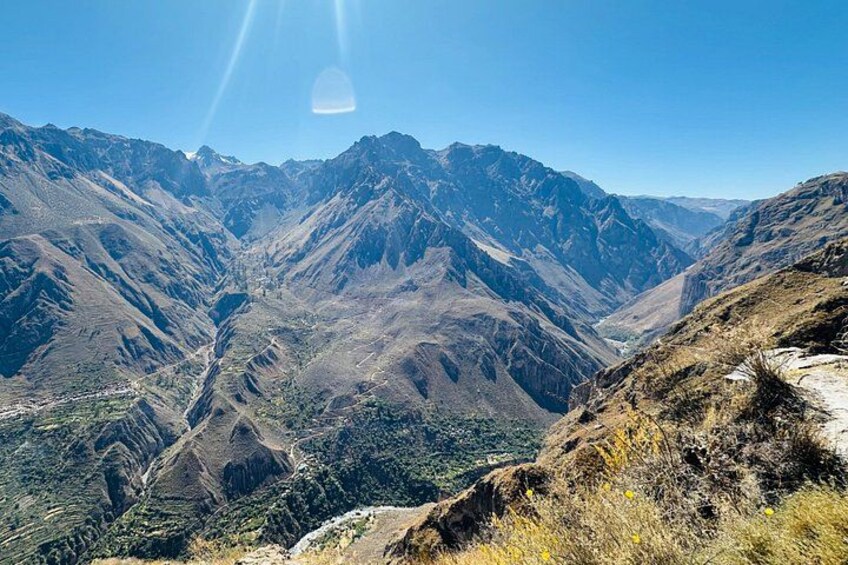 A mountainous landscape with a valley and a clear sky. 5