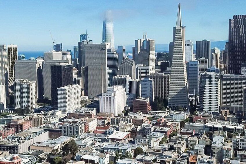 A cityscape with numerous high-rise buildings, including a distinctive skyscraper with a pointed top. 4
