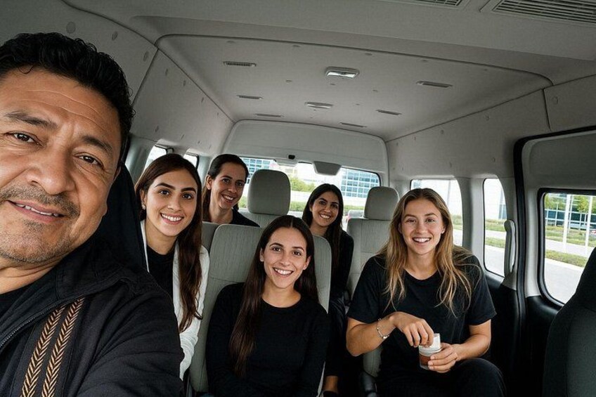 A group of people inside a vehicle with a clear view of the interior and windows. 4