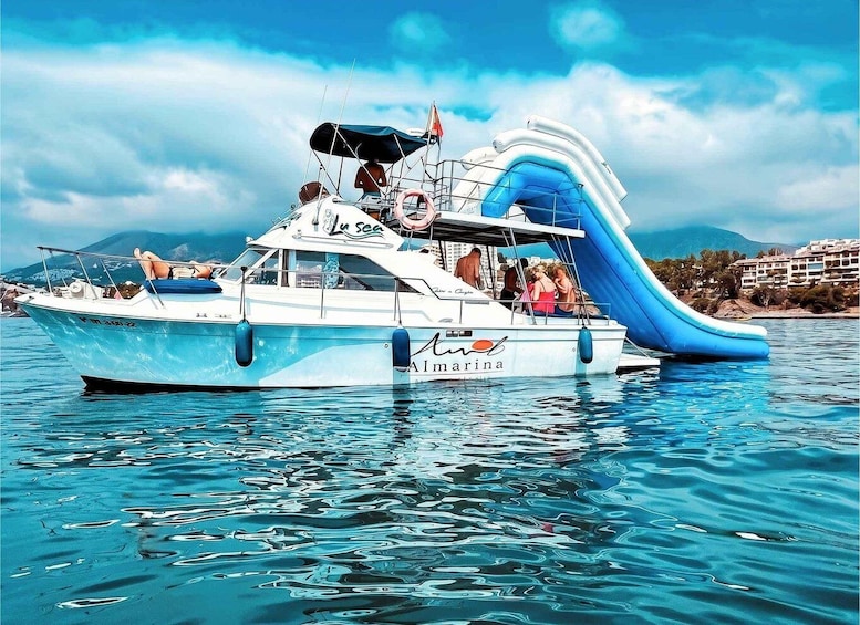 Benalmádena: Private boat with dolphins, snorkeling, activities, and slide 1