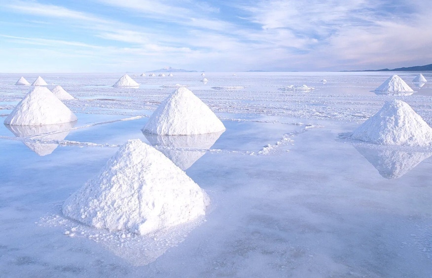 Snow-covered pyramids in a frozen landscape with a clear sky. 1
