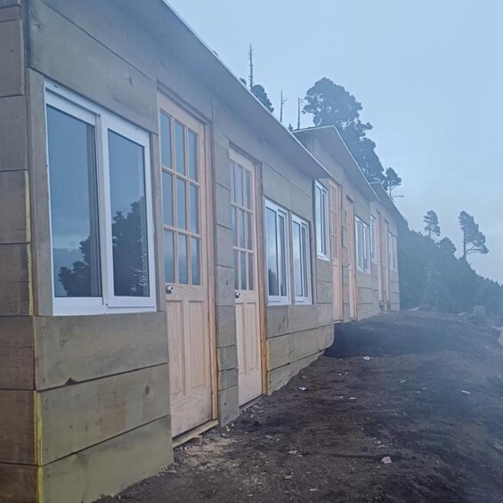 A building with large windows and wooden doors. 5