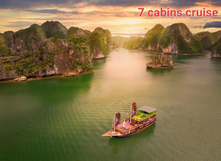 A boat with 7 cabins cruising through a river surrounded by limestone cliffs. 5