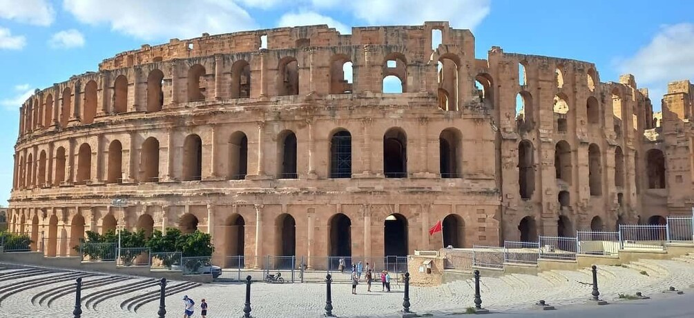 The Colosseum in Rome, Italy, with its iconic arches and ruins. 1