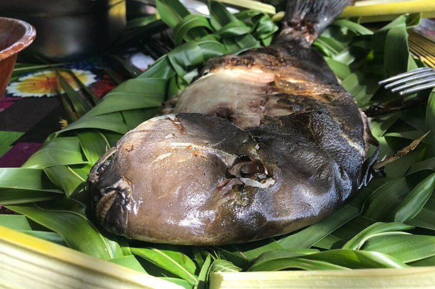 A whole fish on a banana leaf. 3