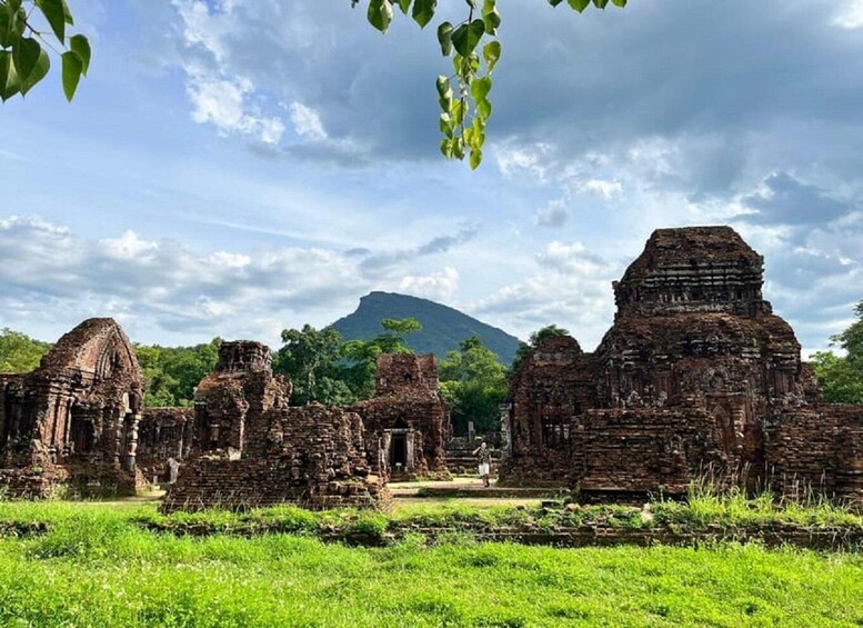 Ancient stone ruins with a mountain in the background. 4