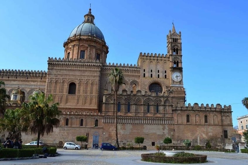 A historic building with a large dome and bell tower. 1