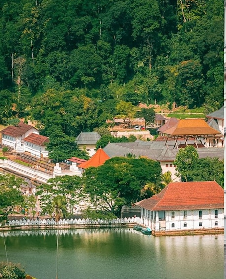 A serene lakeside village with traditional architecture, surrounded by lush greenery. 5