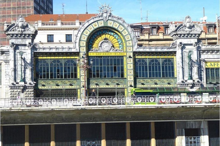 A building with ornate architectural details, including a large arched window and decorative elements. 2