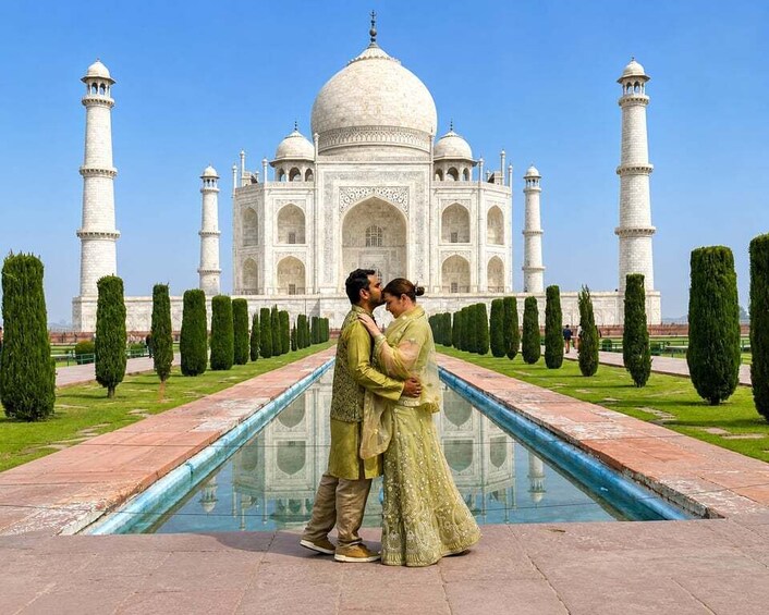 A couple embracing in front of the Taj Mahal, with a reflection pool and manicured gardens. 2