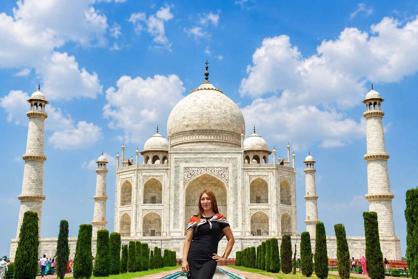 The Taj Mahal with a person standing in front of it. 5