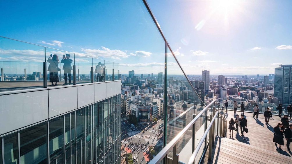 A cityscape with a high-rise building and a pedestrian bridge. 1
