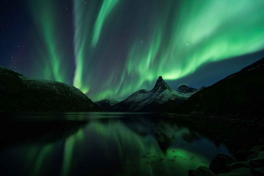 The Northern Lights over a mountain lake at night. 2