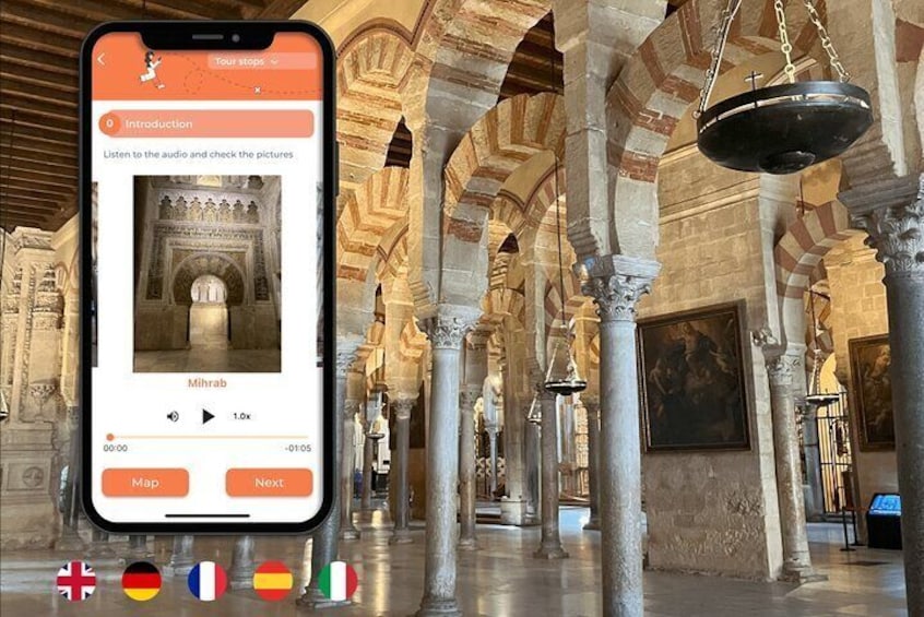 A smartphone displaying a tour guide app with a photo of a mosque's interior. 1