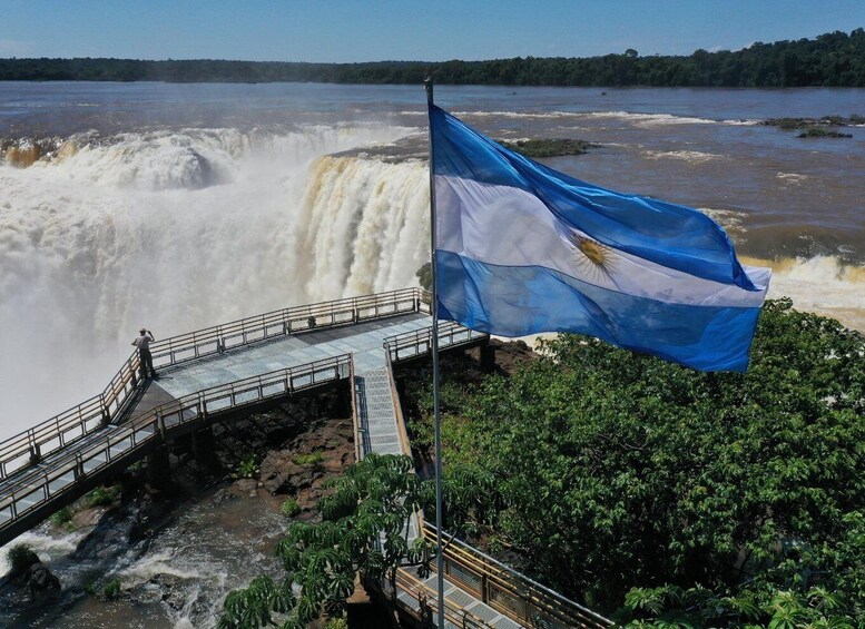 A waterfall, a viewing platform, and a flag. 5