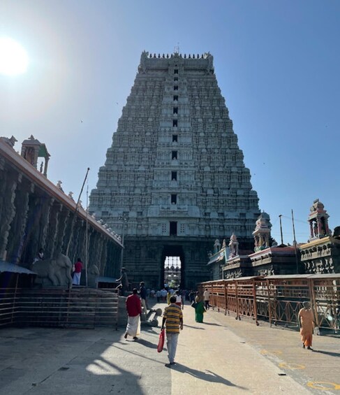 A large temple with a tall, tiered structure and a central doorway. 1