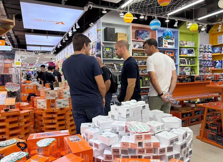 A retail store with shelves stocked with various products, including electronics and toys. 3