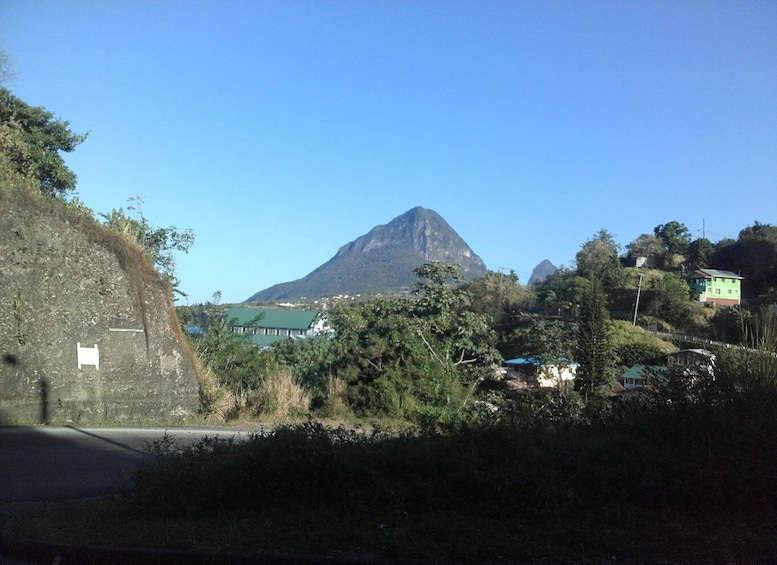 A mountain, houses, and a road. 5
