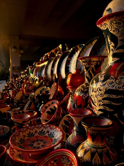 A variety of colorful pottery with intricate designs. 2