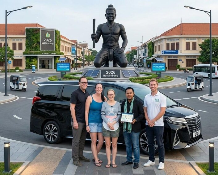 A group of people standing in front of a statue and a car. 2