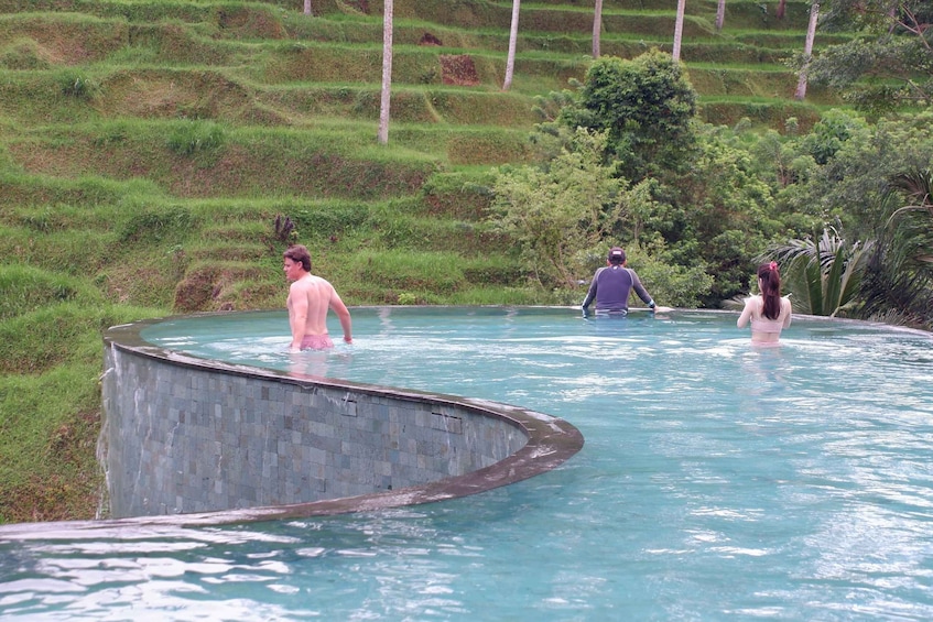 A natural pool surrounded by terraced hills. 3