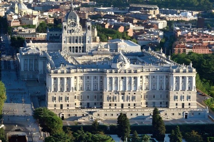 A large historic building with classical architecture, surrounded by a cityscape. 4