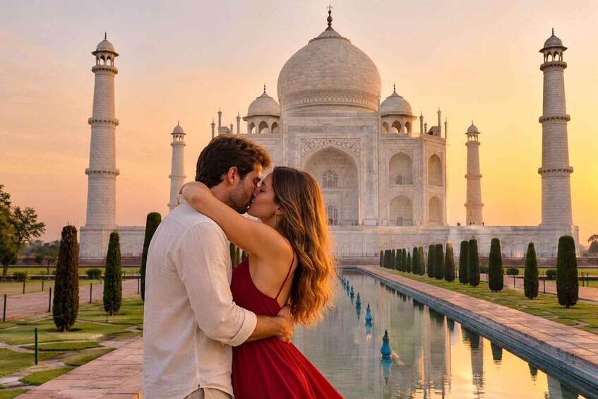 A couple embracing in front of the Taj Mahal with a reflection in the water. 1