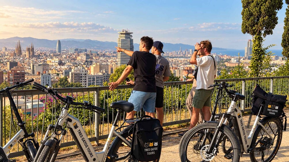 A group of people on a balcony overlooking a cityscape with bicycles and a bag labeled 'TRES GATOS TOURS'. 1