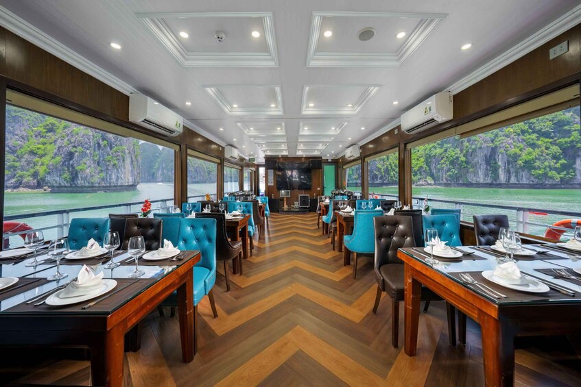 A restaurant with a view of a rocky coastline. 3