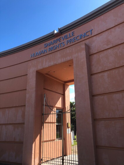 A building entrance with a sign reading "Sharpeville Human Rights Precinct". 4