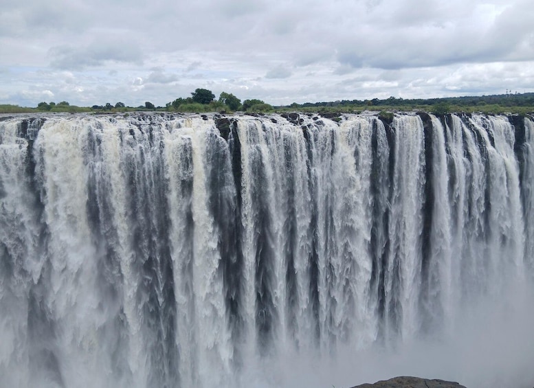 A large waterfall cascading over multiple tiers. 5