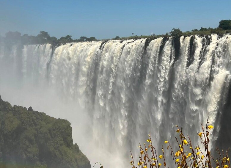 A large waterfall cascading down a cliff. 3