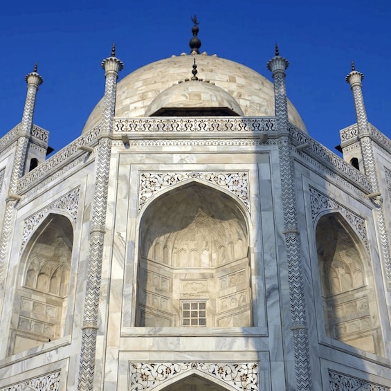 The Taj Mahal's central dome and four minarets. 3