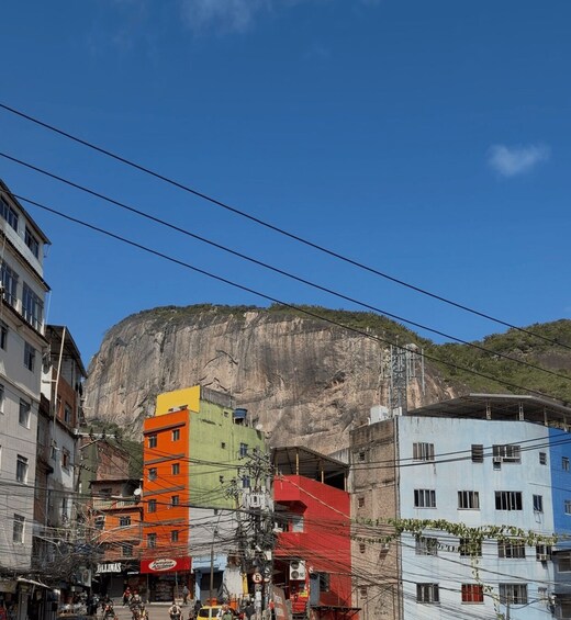 A colorful building with a mountain in the background. 3